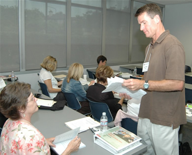 Chris Street, associate professor of secondary education, teaches a workshop for high school English teachers to help them strengthen their students' critical reading and expository writing skills.