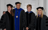 President Milton A. Gordon poses with alumnas Tracy Caldwell and Vicki Vargas and CSU Trustee Melinda Guzman