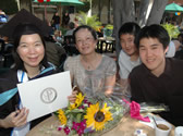 A graduate poses with her family after commencement