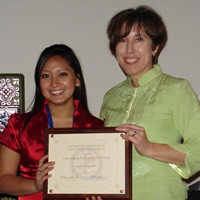 Dawn Macy presenting Jessica Angeles with an award