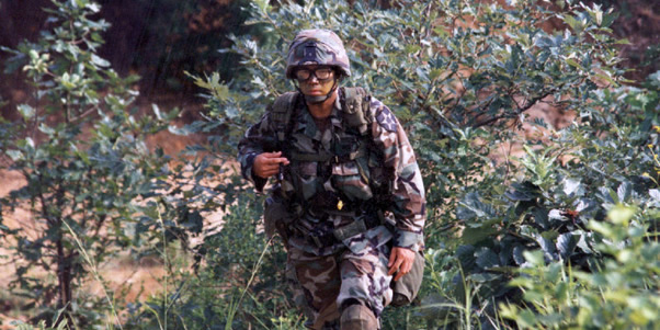 Major Robert H. Medina wearing fatigues in underbrush