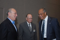 President Milton A. Gordon speaks with Cruz Reynoso and James Montoya