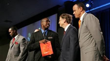 Alumnus Michael Johnson greeting Microsoft founder Bill Gates