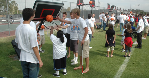 Volunteers and athletes participate in one of many events during the Special Games.