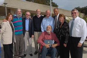 Award recipient Albert Flores poses with earlier recipients and President Milton A. Gordon