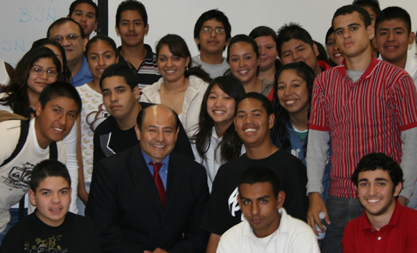 Alumnus and State Senator Lou Correa poses with program participants at a workshop.
