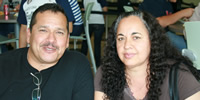 Tony and Maria Avila, parents of a program participant, pose while attending a workshop.