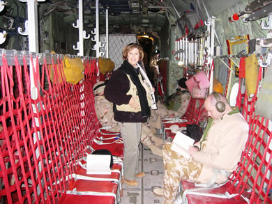 Eileen Padberg in passenger berth of a military cargo plane.