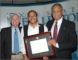 Guardian Scholar graduate Zigmond Berridge, President Gordon and Ron Davis