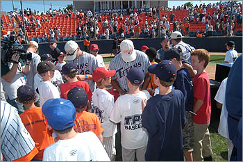 signing autographs