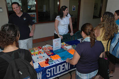 Need chips, water, a highlighter, a calendar of events? Brett Robertson and Serena Cline of New Student Programs had them all Wednesday, Aug. 22, for students attending fall classes at Cal State Fullerton&rsquo;s Irvine Campus. The free giveaways of snacks and information was part of Titan Weeks of Welcome to help students as they began the fall semester.